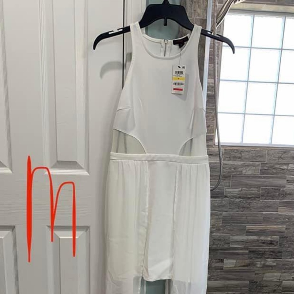 Short white dress with side trains